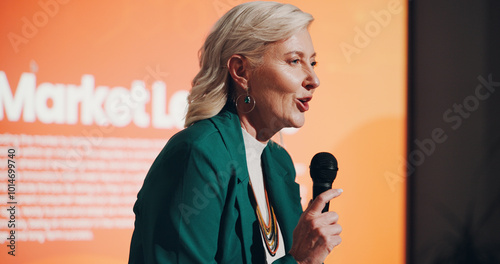 Fotografie Speaker, mature woman and presentation for financial market or investment seminar for employees