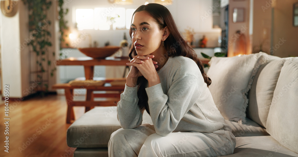 Concern, thinking and worry with woman on sofa in living room of home for contemplation. Anxiety, depression and mental health with person in apartment for memories, nostalgia or weekend planning Concern, thinking and worry with woman on sofa in living room of home for contemplation. Anxiety, depression and mental health with person in apartment for memories, nostalgia or weekend planning