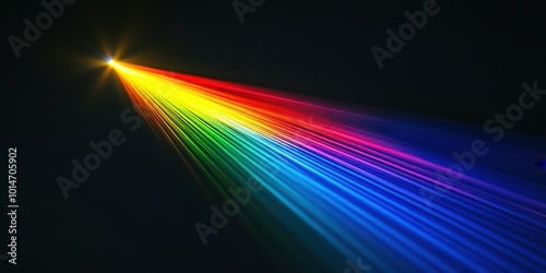 Colorful laser beam creating a vivid rainbow spectrum in a dark background