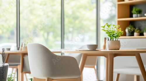 A modern dining area featuring stylish chair and wooden table, surrounded by greenery and natural light, creating serene atmosphere