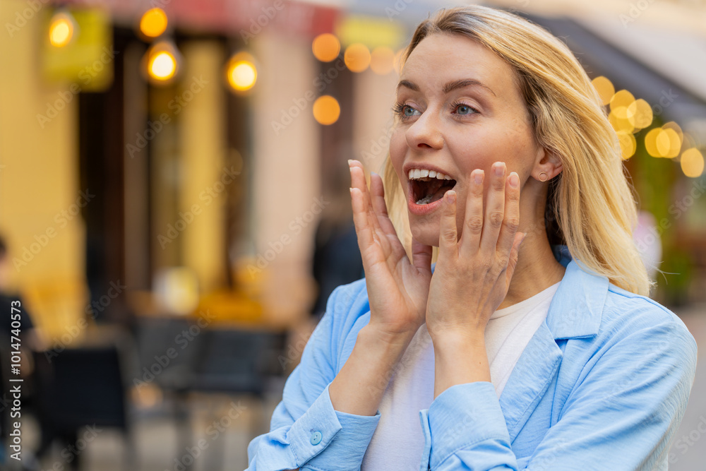 Oh my God, wow. Caucasian young woman looking surprised at side with big open eyes shocked by sudden victory, game winning, lottery goal achievement, good news outdoors. Lady on city sunshine street Oh my God, wow. Caucasian young woman looking surprised at side with big open eyes shocked by sudden victory, game winning, lottery goal achievement, good news outdoors. Lady on city sunshine street