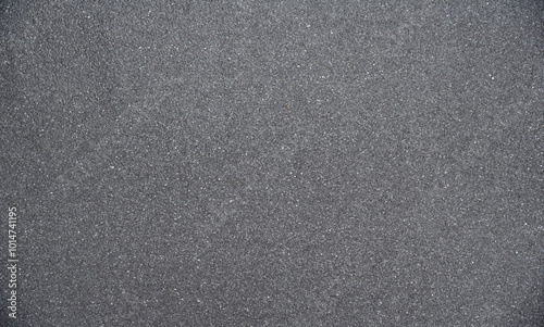 Texture of gray asphalt marble chips on flat roof