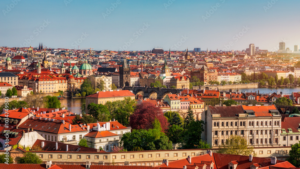 View of Prague featuring vibrant rooftops on a sunny day in summer. Aerial view of Prague, Charles Bridge over Vltava river in Prague, Czechia. Old Town of Prague, Czech Republic. View of Prague featuring vibrant rooftops on a sunny day in summer. Aerial view of Prague, Charles Bridge over Vltava river in Prague, Czechia. Old Town of Prague, Czech Republic.