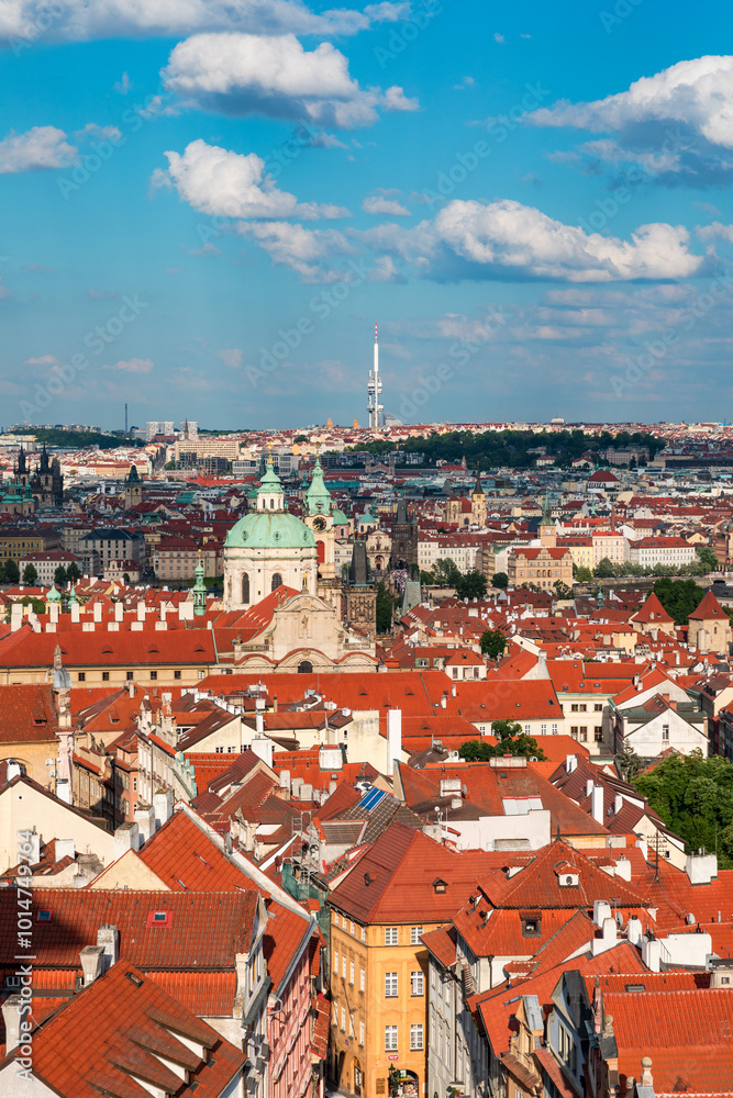 Panoramic view of Prague featuring historic buildings and vibrant rooftops on a sunny day in summer. View of Prague, Czech Republic, showcasing the city's iconic architecture and red-tiled roofs. Panoramic view of Prague featuring historic buildings and vibrant rooftops on a sunny day in summer. View of Prague, Czech Republic, showcasing the city's iconic architecture and red-tiled roofs.