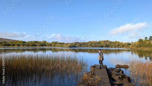 Obraz na płótnie fisherman fishing on shore of Ross lake, Galway, Ireland, spinning, angling, fly fishing, outdoor activities
w salonie