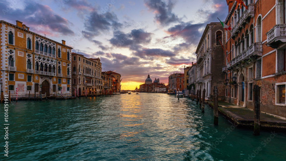 Fototapeta premium Grand Canal at sunrise in Venice, Italy. Sunrise view of Venice Grand Canal. Architecture and landmarks of Venice. Venice postcard