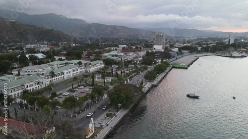 Dili City, Capital of East Timor, seen from the air in the Palacio Beach area, point 0 km of Dili City, before sunset. One of the favorite places in Dili.
