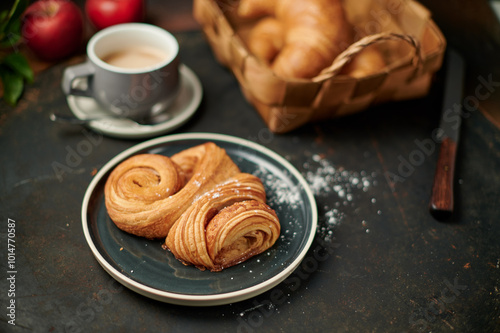 Franzbrötchen an original sweet pastry from Hamburg with a cup of latte
