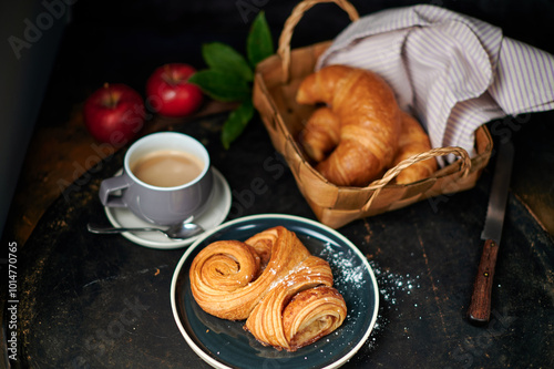 Franzbrötchen an original sweet pastry from Hamburg with a cup of latte