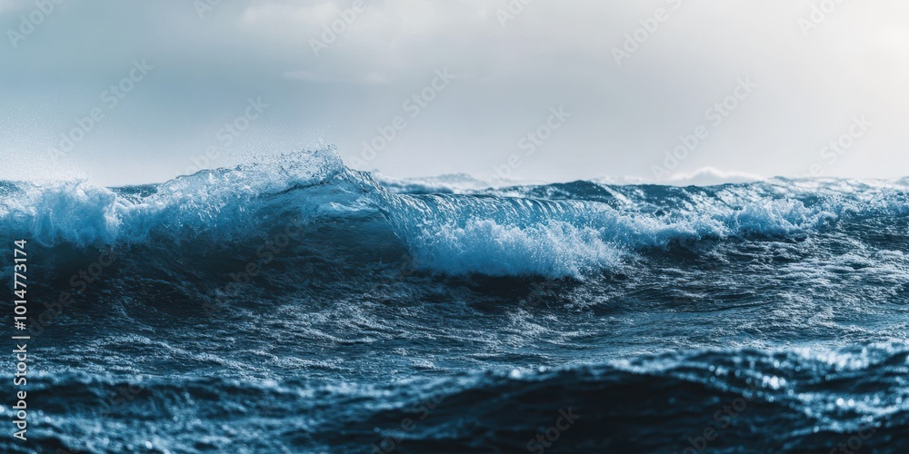 A dramatic ocean scene displaying powerful waves under a cloudy sky, capturing the beauty and intensity of nature's force. A dramatic ocean scene displaying powerful waves under a cloudy sky, capturing the beauty and intensity of nature's force.