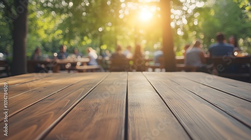 A close up of an empty wooden table with people sitting at tables in the background, a family gathering around for dinner outside on a sunny day, trending photo of an outdoor cafe. 