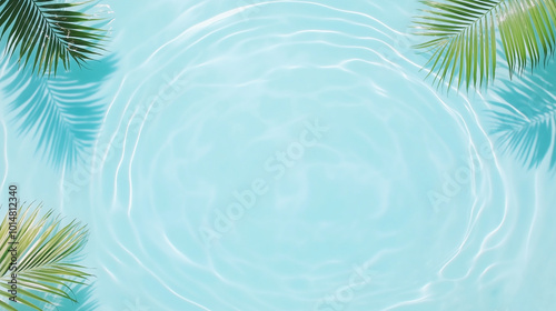 Top view of a blue calm and clear calm water surface, water texture with ripples and shadow of palm leafs, Zen and relaxing background, summer concept.