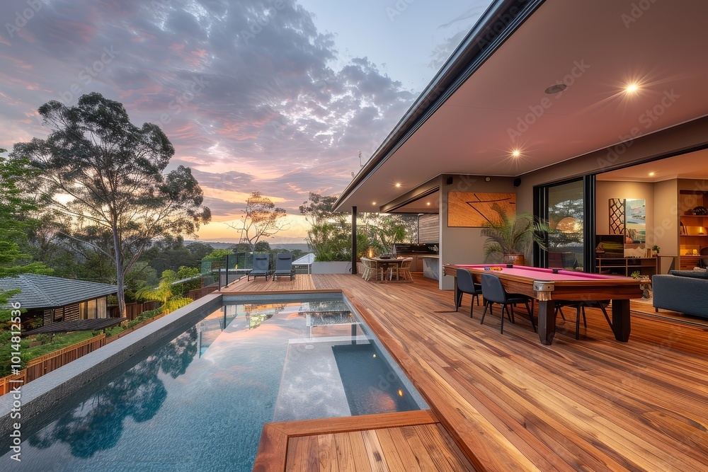 Fototapeta premium Luxury Backyard with Wooden Deck, Pool, and Snooker Table at Sunset. Modern Home and Suburban View in Golden Hour Lighting.
