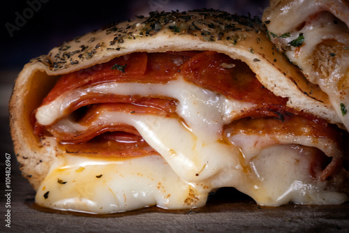 Melted Cheese Pepperoni Pizza Calzone Roll Close Up