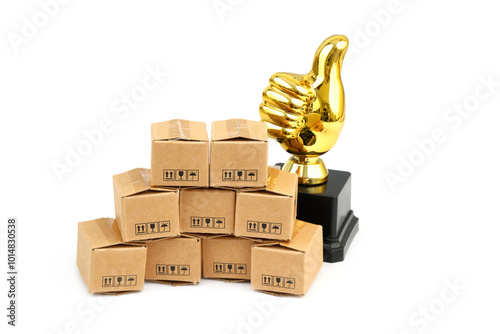 Golden thumbs up  and cardboard boxes isolated on white background. Best production concept.	 photo