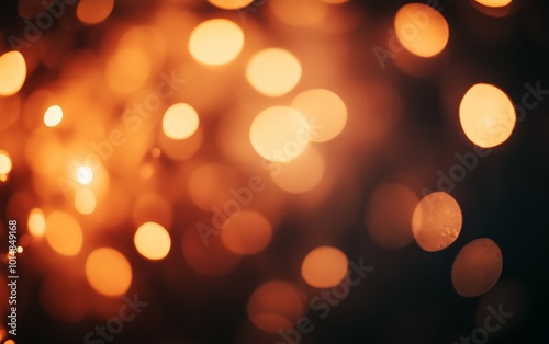 A blurred background of warm orange and yellow bokeh lights, creating a soft, inviting atmosphere.