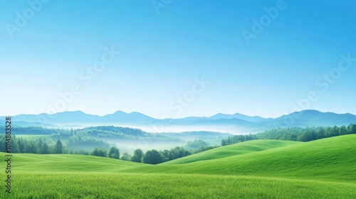 Serene Landscape of Rolling Hills and Distant Mountains Under a Clear Blue Sky