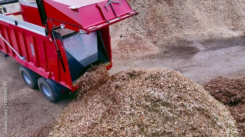Truck Unloading Wood Chips at Biomass Processing Facility
