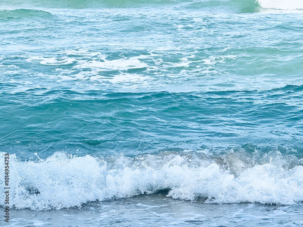 Wave of sea with white foam. water splash in the sea. Splash sea. Clear water and white sand Wave of sea with white foam. water splash in the sea. Splash sea. Clear water and white sand