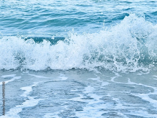 Wave of sea with white foam. water splash in the sea. Splash sea. Clear water and white sand