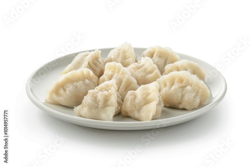 A single serving of steaming hot dumplings on a white plate, perfect for food photography and editorial use