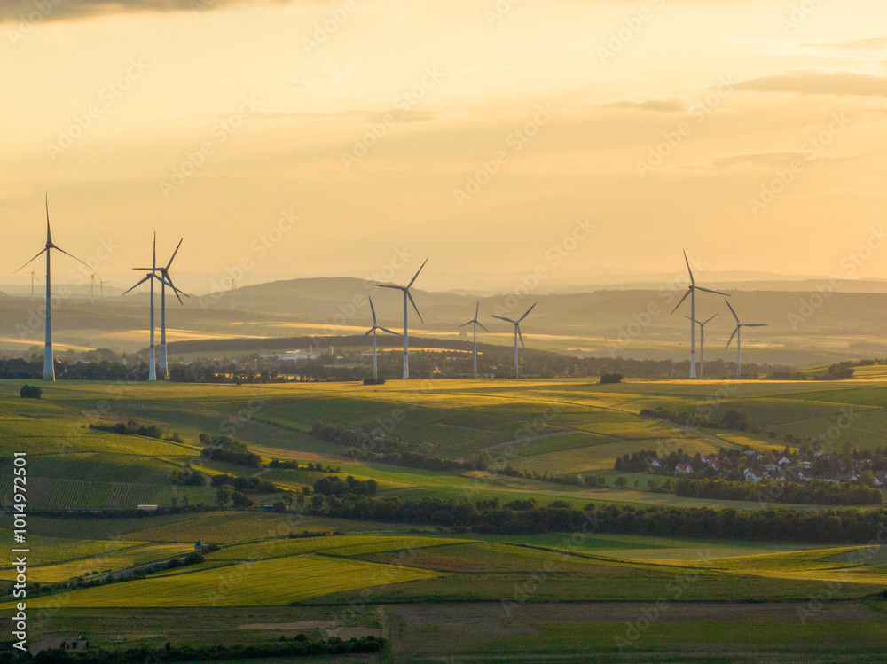 Wind Turbines in a Beautiful Landscape and Sunset Sky. Alternative electricity, sustainable resources, Renewable energy