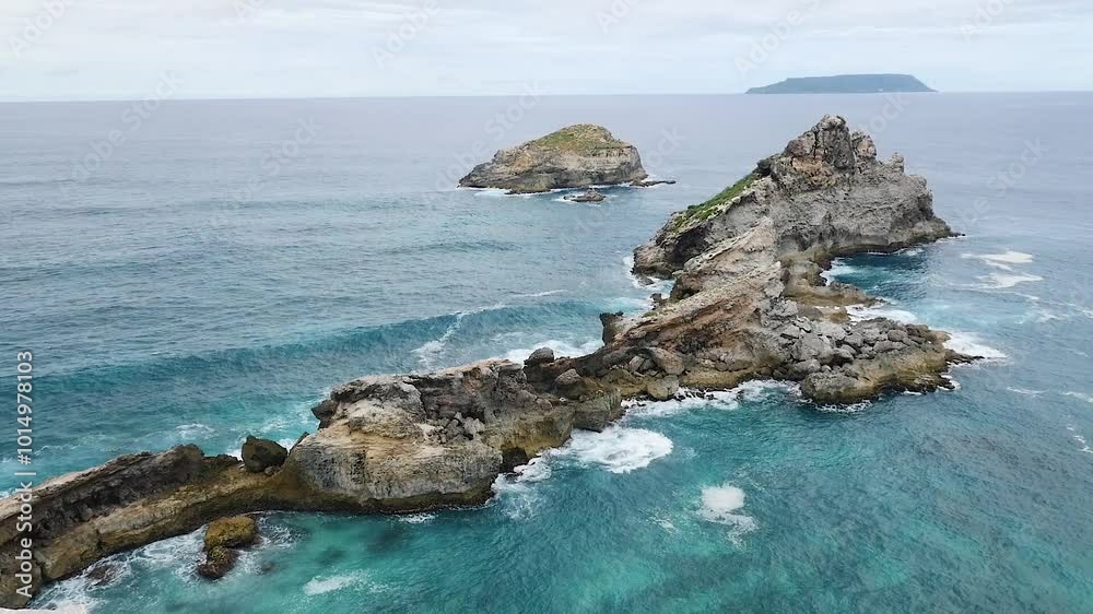 View of calm bumping rocks in the ocean in Pointe des Chateaux in Guadeloupe slow motion View of calm bumping rocks in the ocean in Pointe des Chateaux in Guadeloupe slow motion