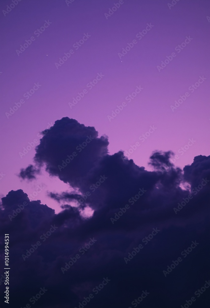 Surreal Twilight Cloudscape with Colors Transitioning from Violet to Blue Under a Starry Sky