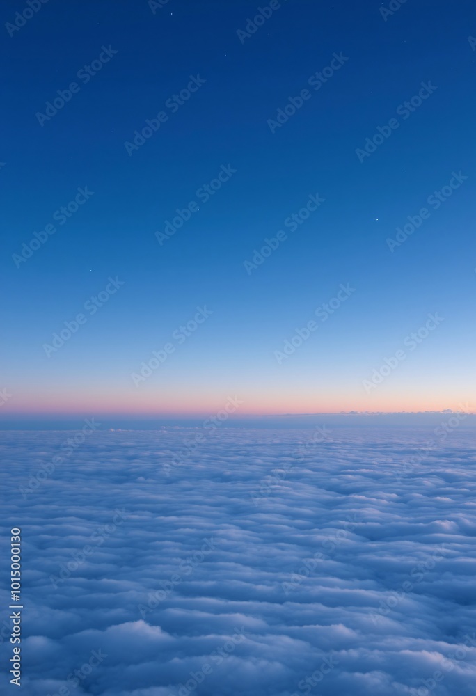 Obraz premium Twilight Shifting into Deep Blue as Stars Appear Above a Quiet Sea of Clouds