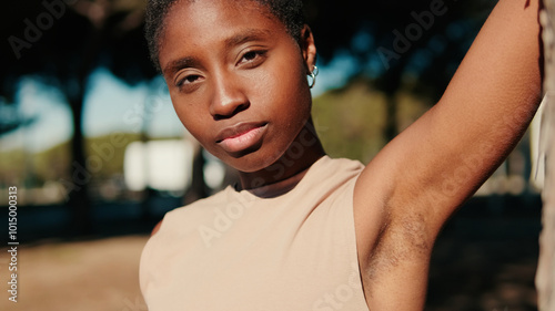 Close-up of calm girl enjoying nature on a sunny day in the park, bodypositive and body diversity concept photo