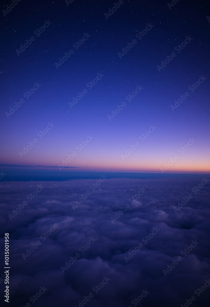 Fototapeta premium Deep Blue and Purple Sky with Fluffy Clouds Stretching to the Horizon Under a Blanket of Stars