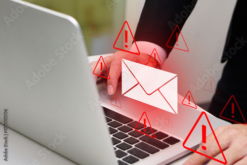 Person using laptop with virtual screen of spam virus email inbox alerts, warning alerts. Email spam, spam messages and email security protection concept.