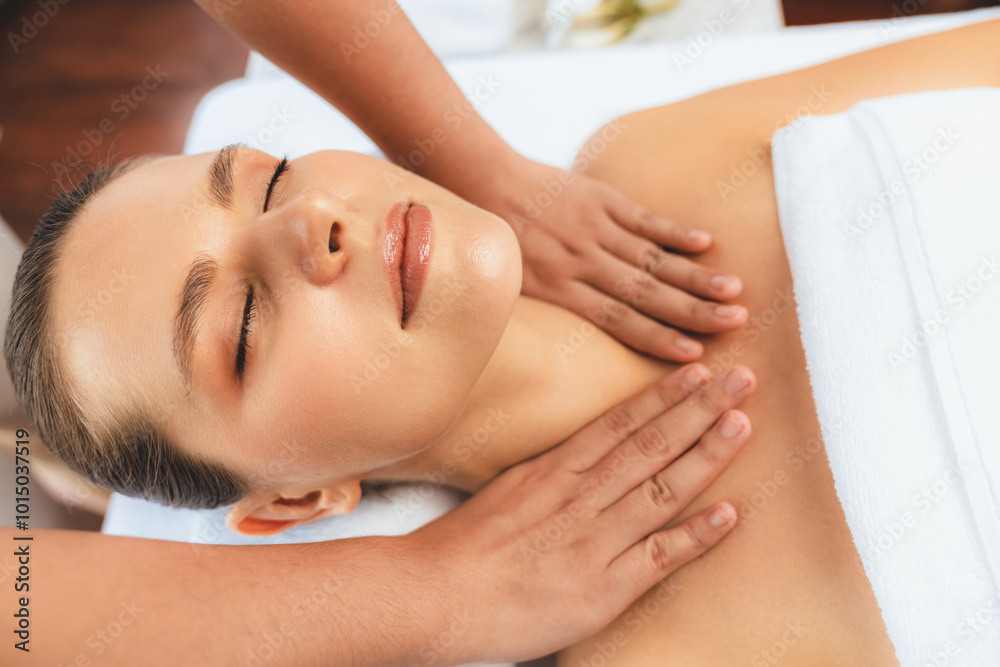 Caucasian woman customer enjoying relaxing anti-stress spa massage and pampering with beauty skin recreation leisure in day light ambient salon spa at luxury resort or hotel. Quiescent Caucasian woman customer enjoying relaxing anti-stress spa massage and pampering with beauty skin recreation leisure in day light ambient salon spa at luxury resort or hotel. Quiescent
