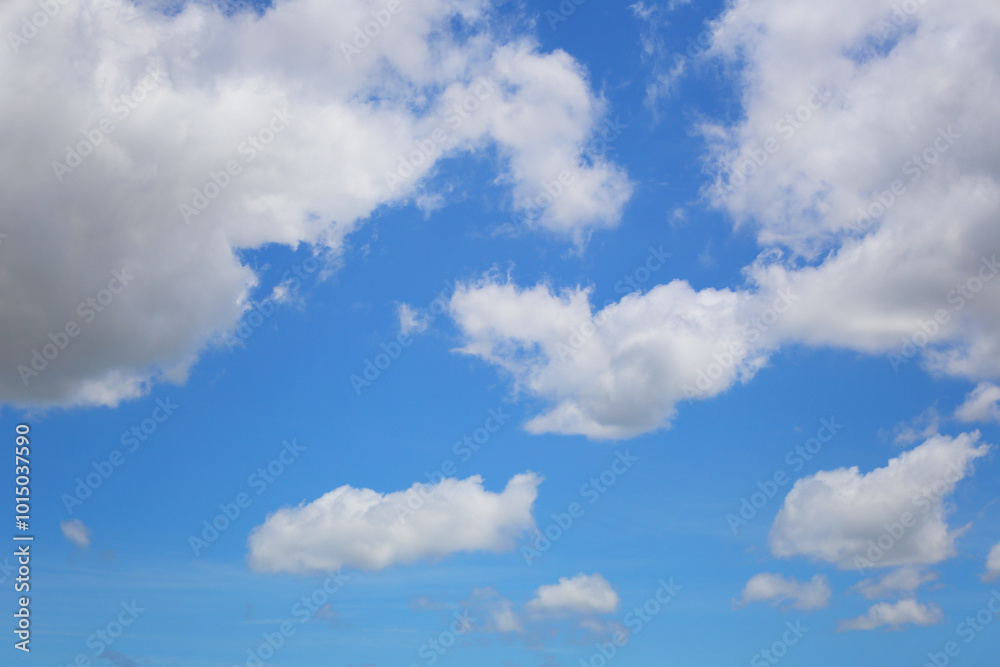 Blue sky with white clouds in the daytime background. Blue sky with white clouds in the daytime background.