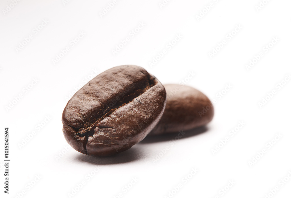 Obraz premium Studio, space and organic coffee beans with caffeine, reflection and closeup of small business cafe. Espresso, grain and fresh roast with flavor, mockup and local drink culture on white background