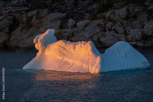 iceberg reflects sunset