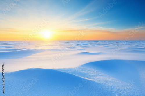 Sunrise over the pristine snow-covered landscape with gentle hills near a frozen horizon