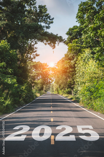 New year 2025, Text 2025 written on the road in the middle of asphalt road at sunset. Concept of planning, opportunity, hope, business strategy, new life change.
