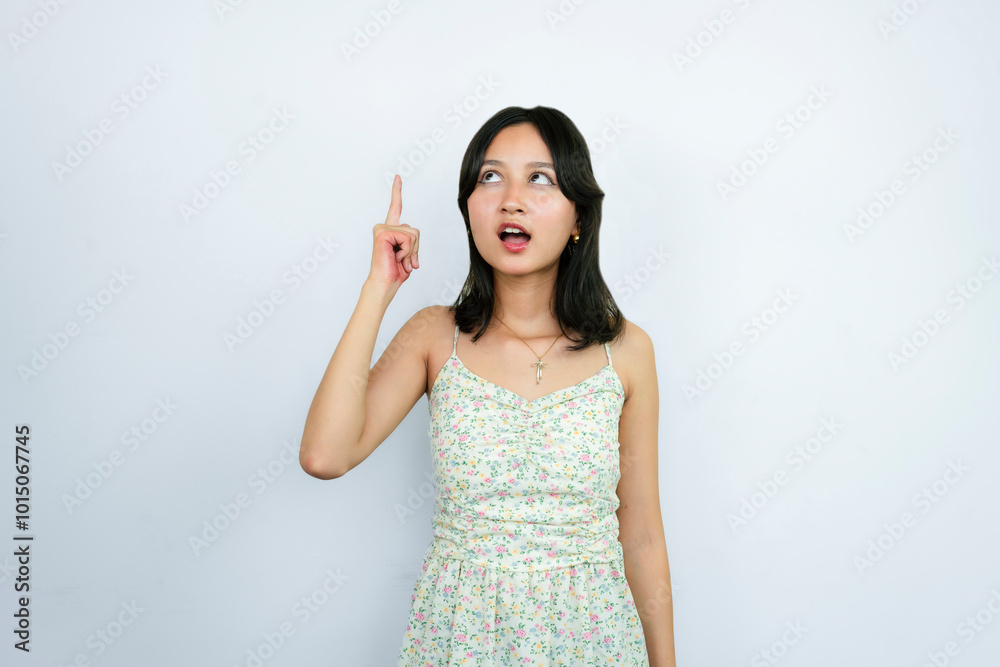 Young Asian Girl Pointing with Fingers And gives happy Expressions of Wow Young Asian Girl Pointing with Fingers And gives happy Expressions of Wow