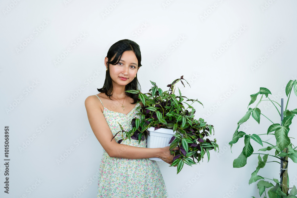 Young Asian Female Gardener Florist With Indoor Garden Plants Young Asian Female Gardener Florist With Indoor Garden Plants