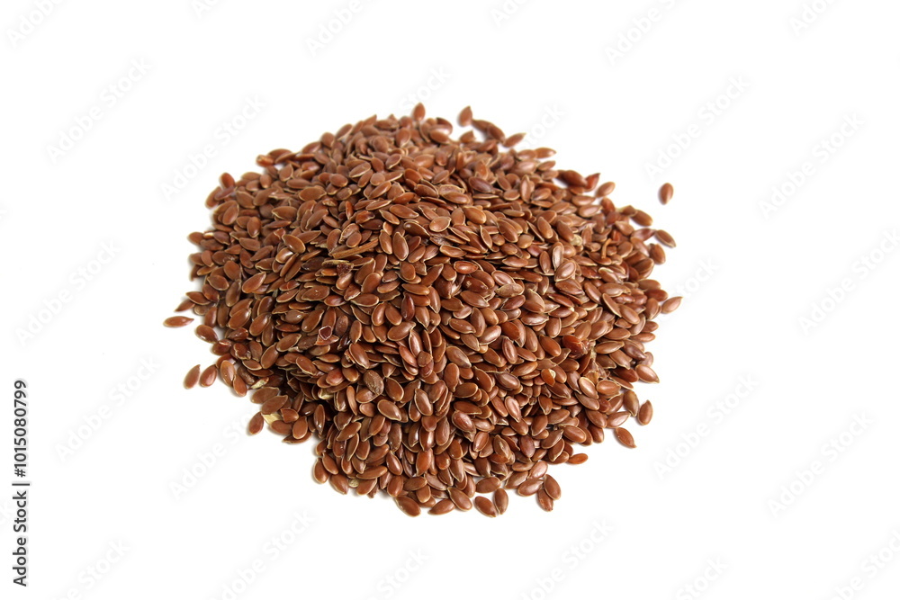 Flax seeds lie in a pile on an isolated	