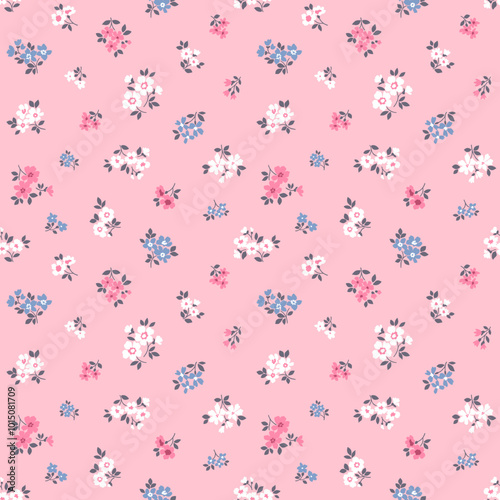 Vector seamless pattern. Vintage pattern in small flowers. Small white, pink and blue flowers. Rose pink background. Ditsy floral background. Hand drawn flowers. Abstract modern trendy pattern.