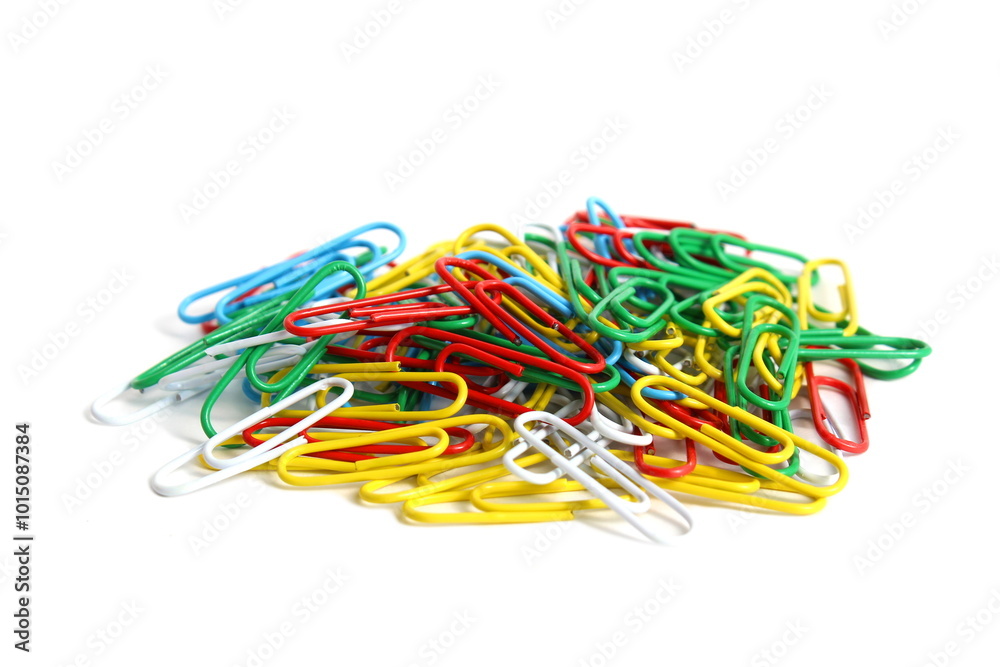 There are brightly colored paper clips on a white background. There are brightly colored paper clips on a white background.