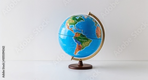 Earth globe showing oceans and continents on a plain white background.