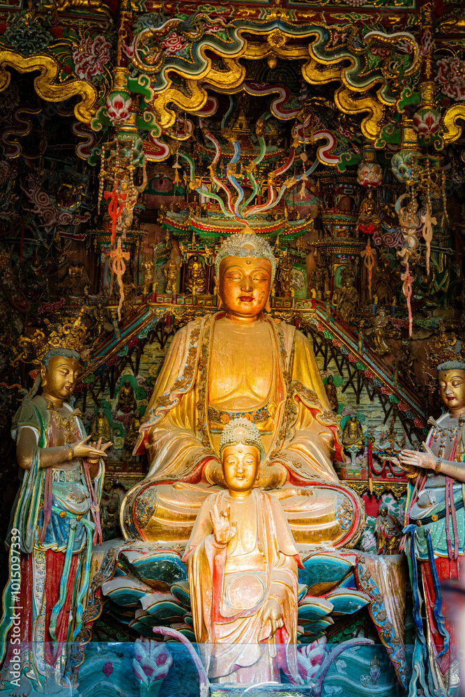 Fototapeta premium Stone statue of cross-legged Bodhisattva in Cave 18 of Yungang Grottoes, Datong, Shanxi Province