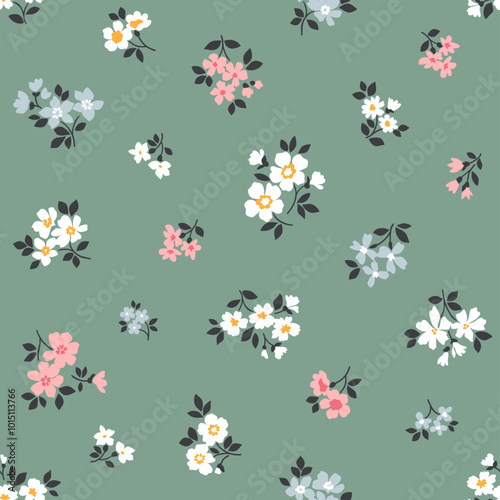 Beautiful floral pattern in small flowers. Small pink, white and blue flowers. Blue gray background. Ditsy print. Floral seamless background. Stock vector for printing on surfaces. Abstract flowers.