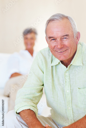 Old man, portrait and happy in home for relax, weekend and retirement on sofa with good health. Elderly people, face and smile for comfort, peace and break on couch in living room with positive mood