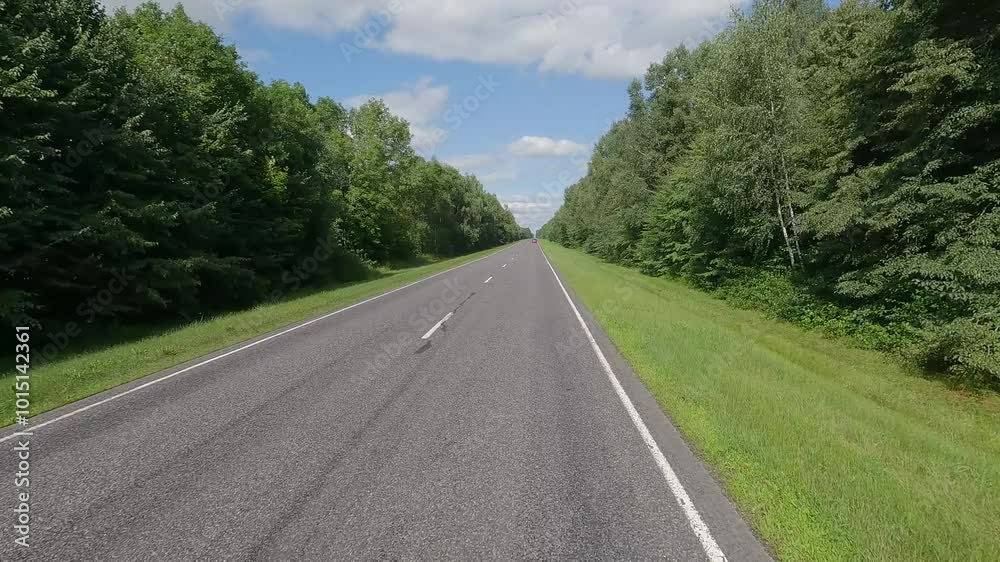 Road view on a summer day. Highways and cars, roadside and white road line markings. Road view on a summer day. Highways and cars, roadside and white road line markings.