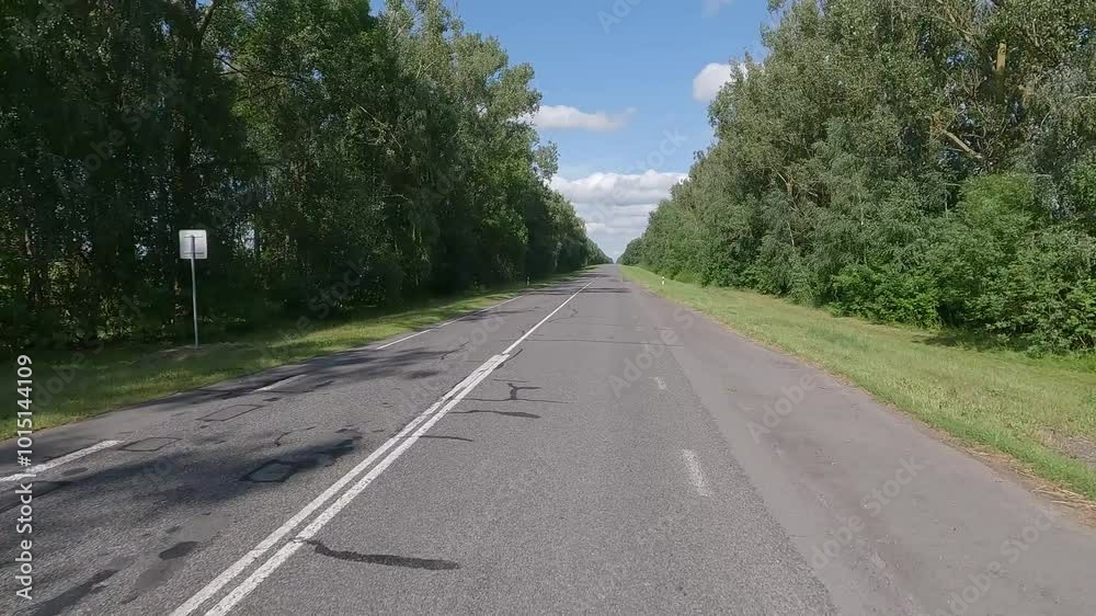 Road view on a summer day. Highways and cars, roadside and white road line markings. Road view on a summer day. Highways and cars, roadside and white road line markings.