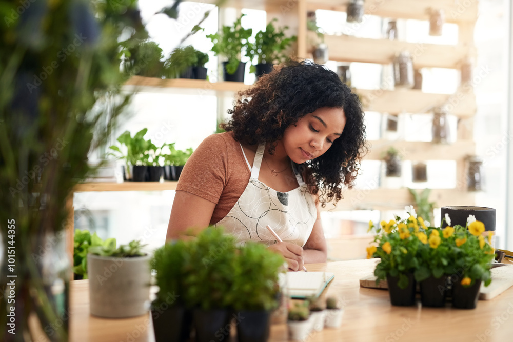 Woman, florist or writing with flowers for small business, inventory or agriculture at botany store. Young, female person or botanist taking notes on notebook for eco service, plants or order at shop Woman, florist or writing with flowers for small business, inventory or agriculture at botany store. Young, female person or botanist taking notes on notebook for eco service, plants or order at shop